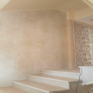 Matt cream stone-effect indoor wall tile for versatile hallways